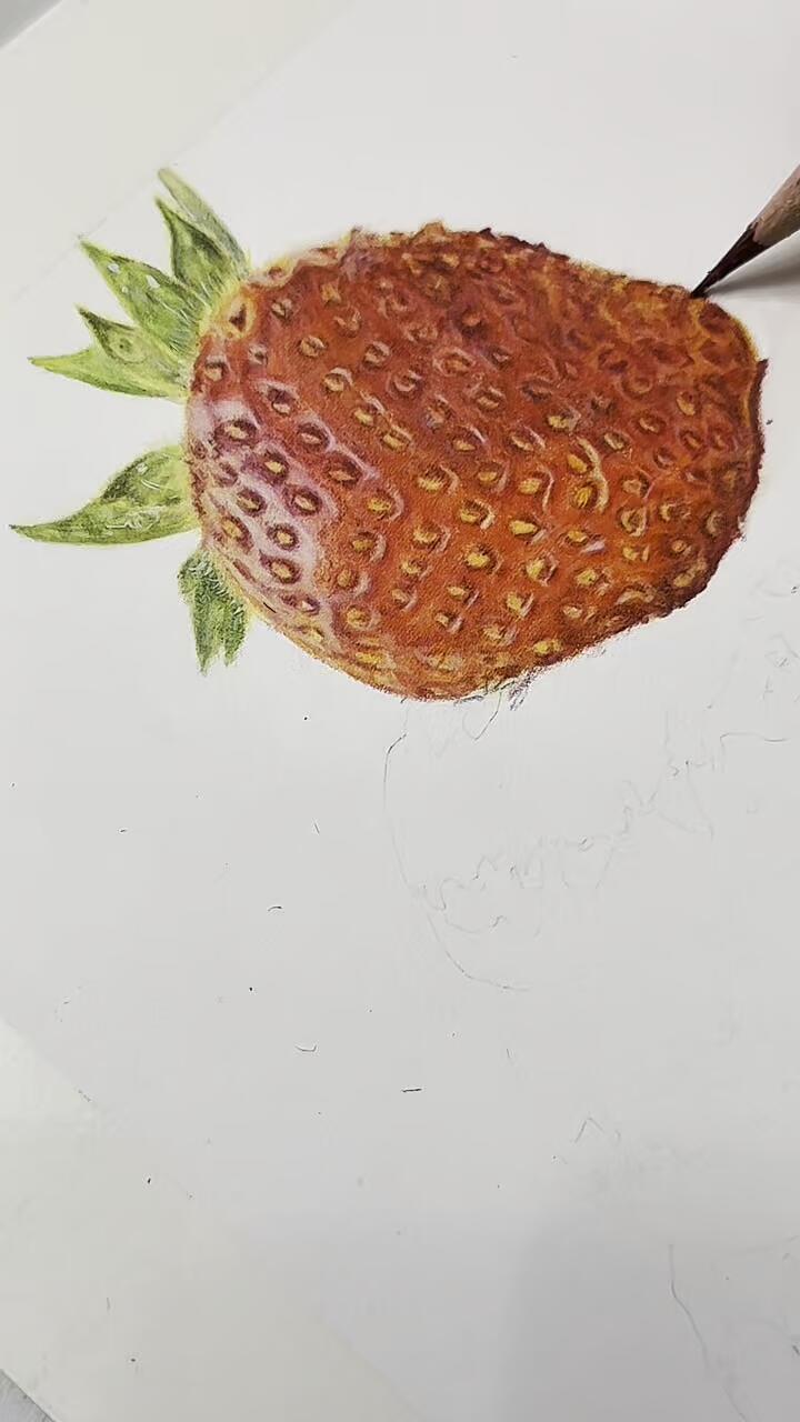 Working on a strawberry atop a cupcake using Faber-Castell Polychromos coloured pencils